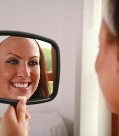 Patient smiling after a dental hygiene cleaning at Southdown Dental