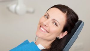 patient in dental chair awaiting dentist