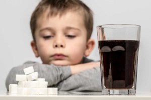 child will get cavities from drinking soda with lots of sugar
